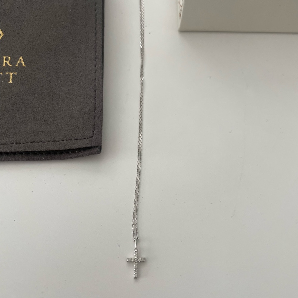 Cross 14k white gold. 0.048 carats. Brand new never worn .